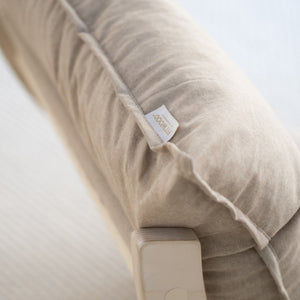 Close-up of a FitWood cushion with a visible tag, emphasising high-quality, durable fabrics used for easy care and longevity in FitWood products.