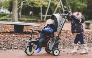 Children enjoying the smarTrike stroller trike outdoors - versatile design for comfortable strolling and riding by Little Gliders