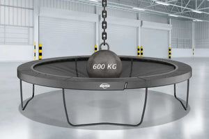 BERG trampoline tested with 600 kg weight in industrial setting, showcasing extreme durability and high safety standards.
