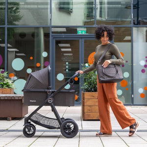 Mother strolling with Babymore stroller – Little Gliders modern and stylish baby travel solutions and quality nursery furniture from dribs, cots and cot beds.