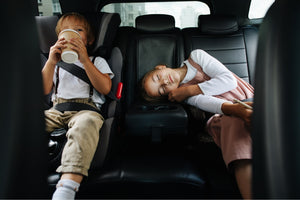 Two children safely seated in car – Little Gliders' collection of car seats for comfort and security on family trips