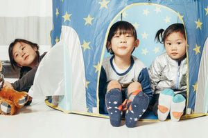 Three children playing in starry play tent – Little Gliders indoor playtime essentials for imaginative fun
