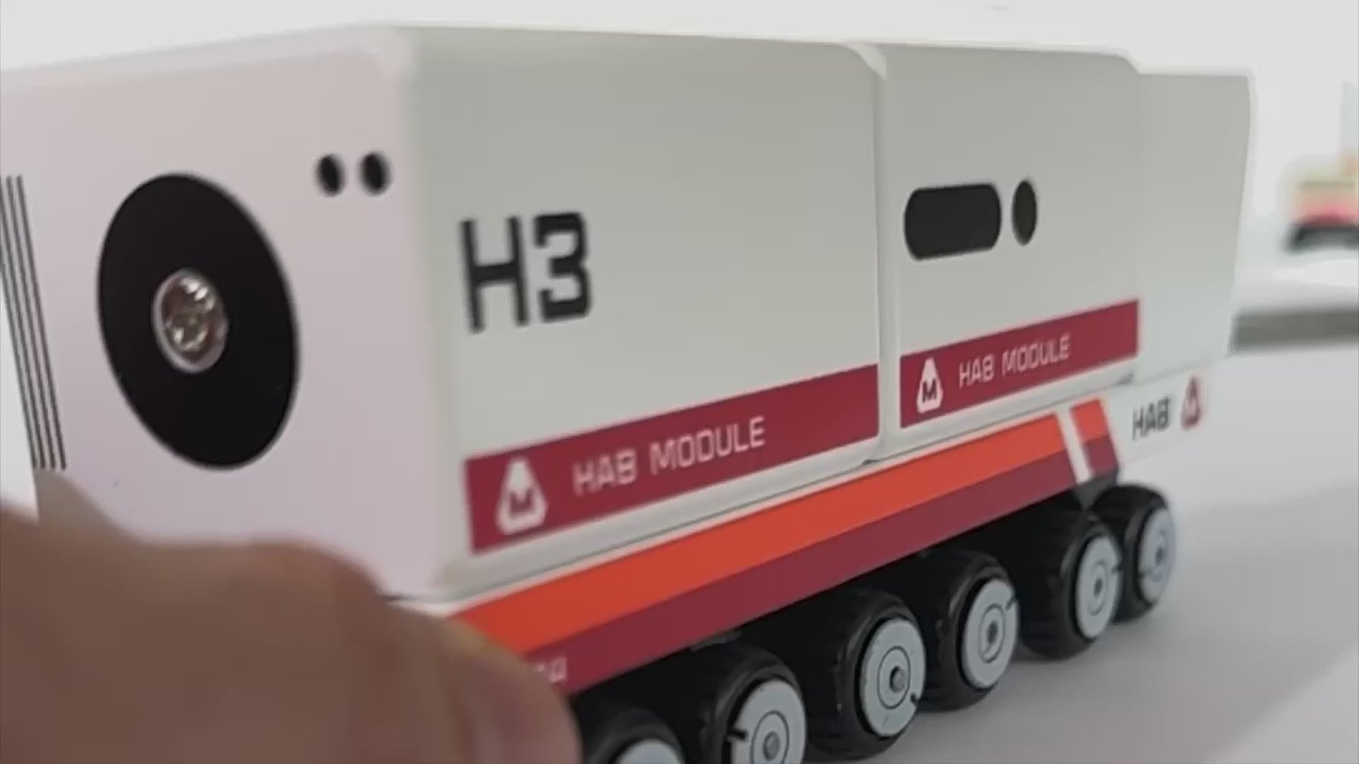 Close-up video of Candylab MARGE Dark Depths wooden vehicles navigating modular Mars road tracks – perfect for creative STEM-themed play