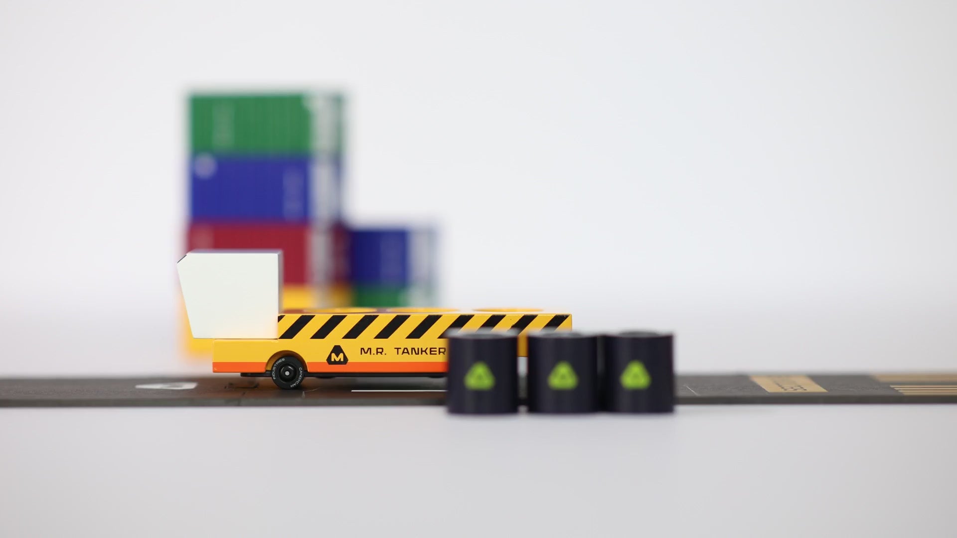 Child loading and transporting HAB modules with Candyland MR. Tanker magnetic transporter toy.