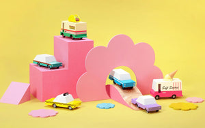 Candylab wooden toy cars and trucks in colourful imaginative play setup – handcrafted vintage-style vehicles including taxi, ice cream truck, and classic cars for creative and open-ended play