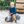 Young child riding a silver Audi Baghera ride-on car outdoors – officially licensed vintage-style metal toy vehicle for toddlers, designed for imaginative play and developing motor skills
