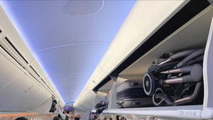 Didofy Aster 2 stroller easily stored in an airplane overhead compartment, demonstrating its compact, foldable, and travel-friendly design.