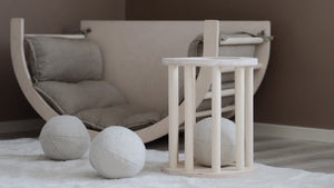 FitWood play set featuring a cushioned rocking chair and soft birch wood balls, designed for active play and relaxation. Perfect for children's rooms with a focus on sustainability, comfort, and natural Nordic design.