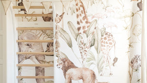 FitWood wall bars installed in a child's room with safari animal-themed wallpaper, blending functional fitness equipment with playful decor.