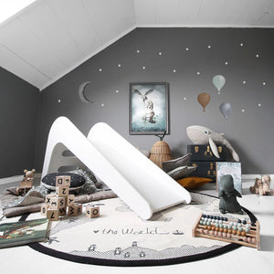Stylish playroom with Jupiduu indoor slide, featuring playful decor and educational toys, ideal for active play indoors at Little Gliders