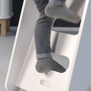 Close-up of child stepping on the Jupiduu slide with non-slip steps, ensuring safe indoor play for toddlers and kids. Shop at Little Gliders
