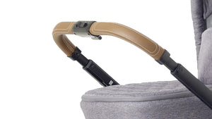 Detailed view of the leather handlebar on the Mee-go Uno+ pushchair, highlighting the premium stitching.
