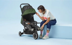 Mother adjusting smarTrike reclining stroller canopy - premium comfort and shade for napping toddler by Little Gliders