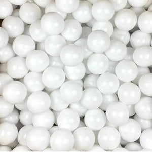 Close-up of white plastic play balls, perfect for filling ball pits or sensory play areas, designed for durability and safety – available at Little Gliders.