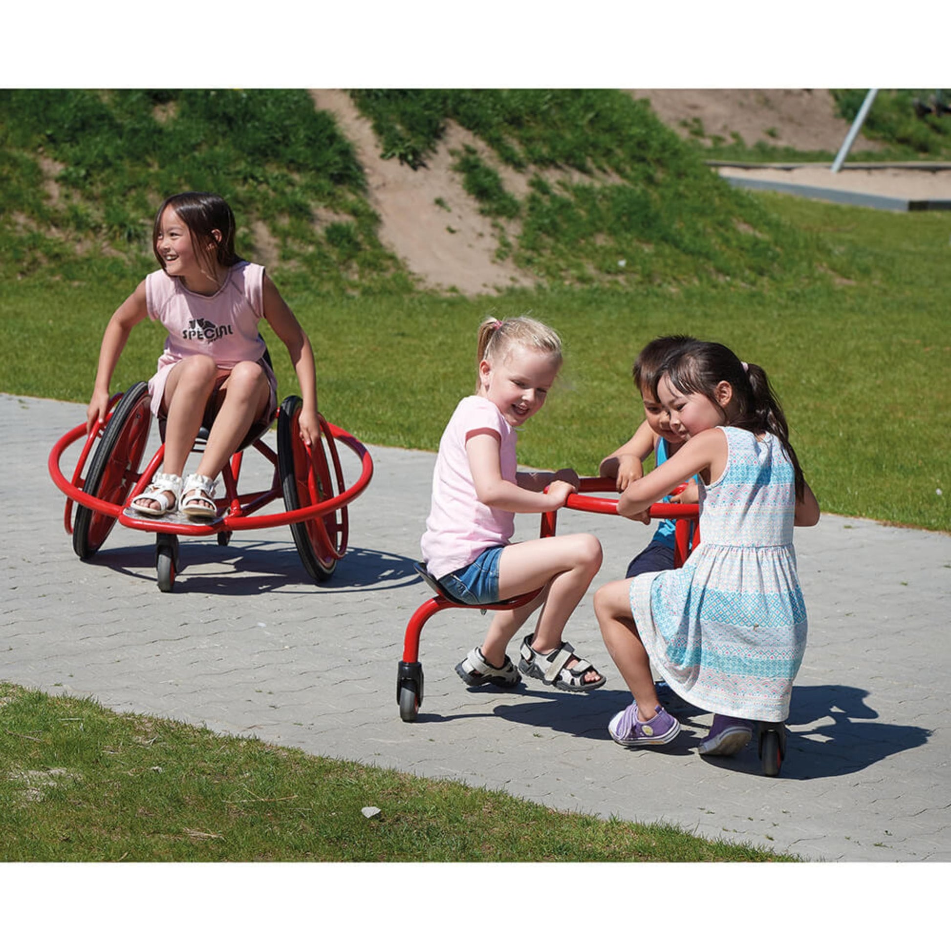 Children enjoying outdoor play with Winther Circleline vehicles, fostering teamwork, balance, and active fun – available at Little Gliders.