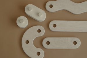 Close-up of wooden balance beam components from Fitwood, showcasing the modular design ideal for active play and child development.