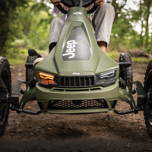 Close-up of a Jeep-themed green go-kart with realistic front grille and headlights, designed for off-road fun.